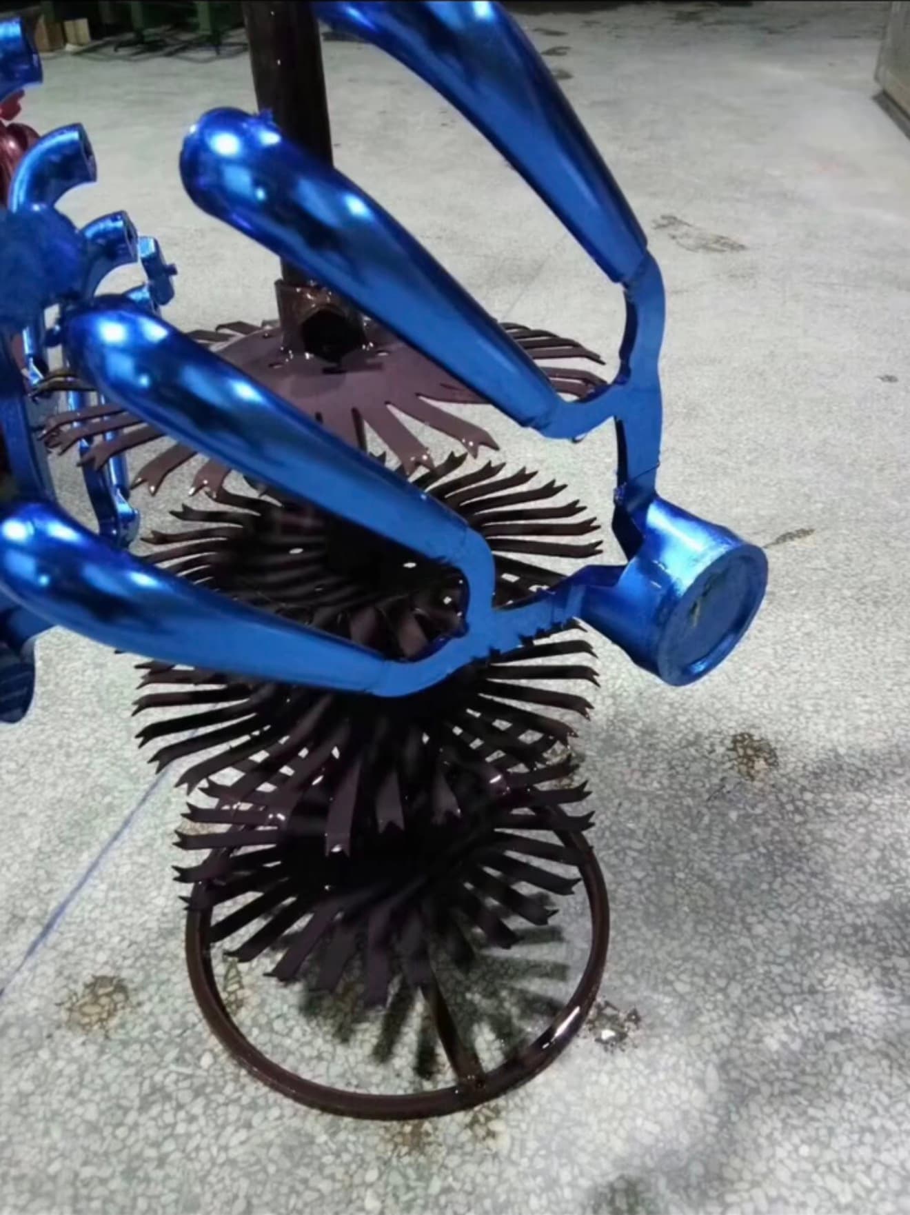 Blue anodized die-cast full-shot demonstration sample with gates and overflows attached